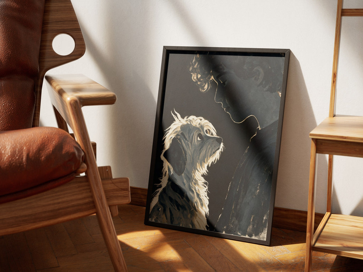 Devotion dog and owner wall art framed in black, styled in a sunlit room with a walnut chair and oak shelving.