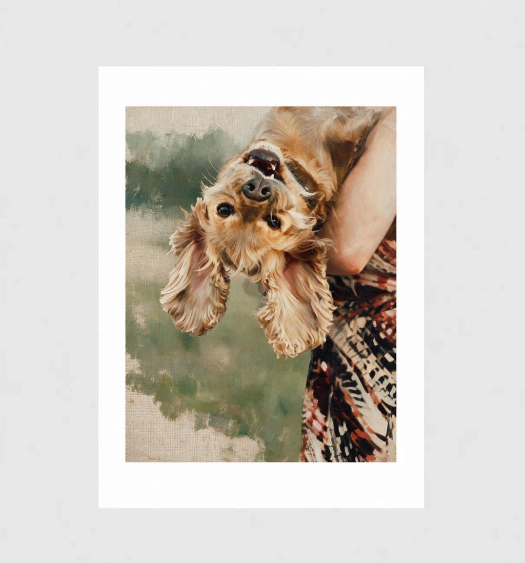 Flip by Muse and Paw, a painterly print of a cocker spaniel held upside down by its owner, framed and leaning against a wall.
