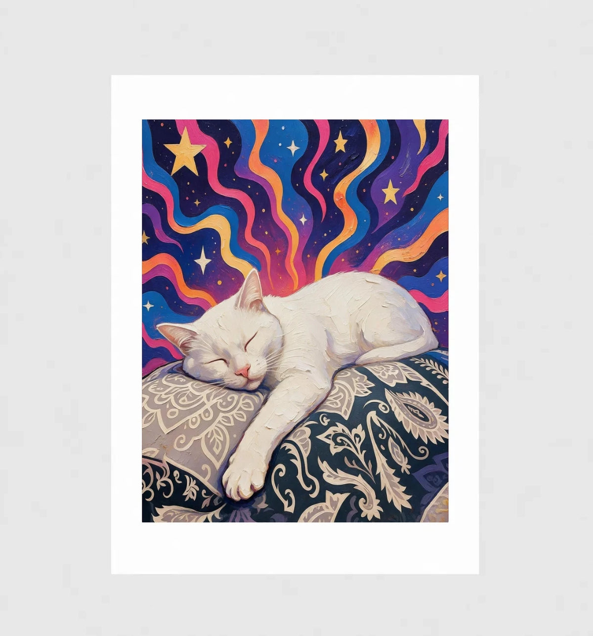 Reverie by Muse and Paw, an illustrated print of a white cat sleeping on a paisley cushion beneath coloured ribbons and gold stars, shown flat as a bordered fine art print.