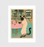Wash Your Paws by Muse and Paw, a Siamese cat standing at a pink basin under a framed sign reading wash your paws, in Japanese woodblock style, shown flat as a bordered fine art print.